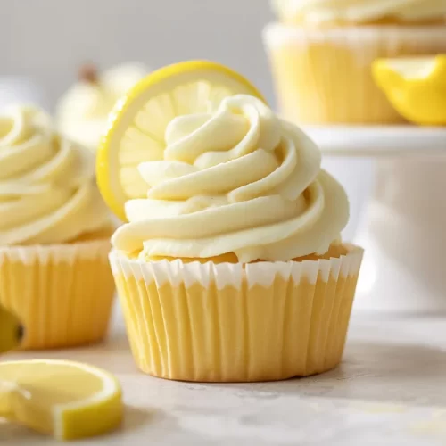 Moist Lemon Cupcakes topped with zesty Lemon Buttercream frosting.