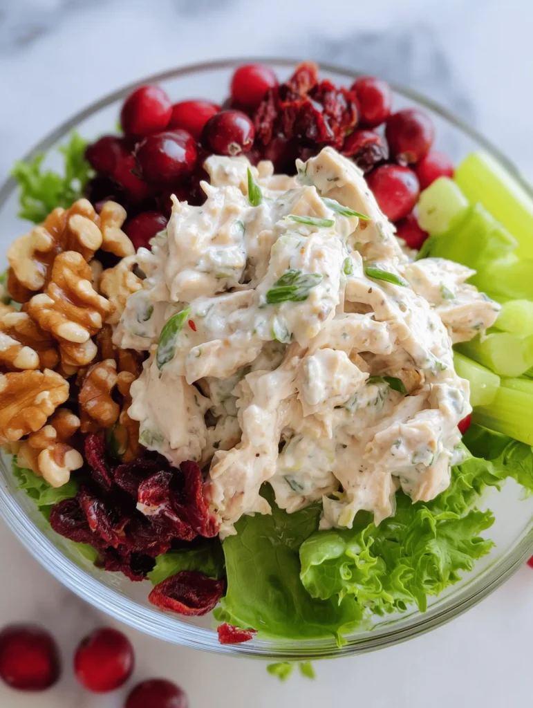 Cranberry walnut chicken salad with walnuts, cranberries, and creamy dressing in a bowl.