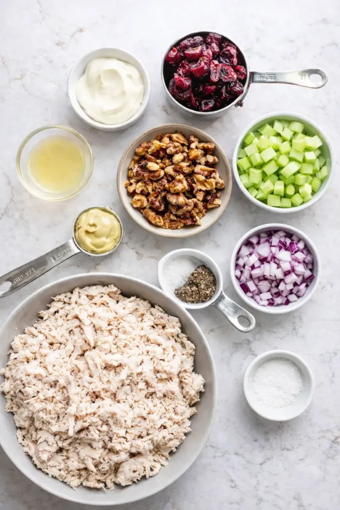 Cranberry walnut chicken salad with walnuts, cranberries, and creamy dressing in a bowl.