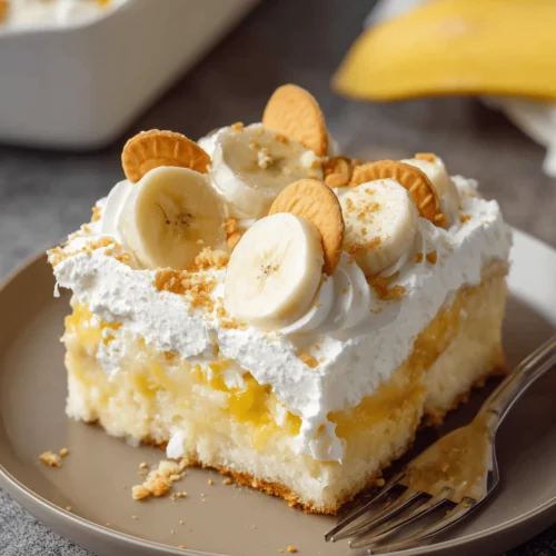 Delicious Banana Pudding Poke Cake topped with Cool Whip and crushed Nilla Wafers