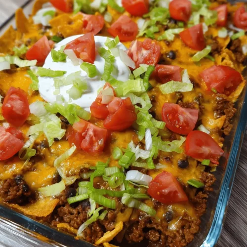 Delicious Walking Taco Casserole with cheese, ground beef, and Fritos.
