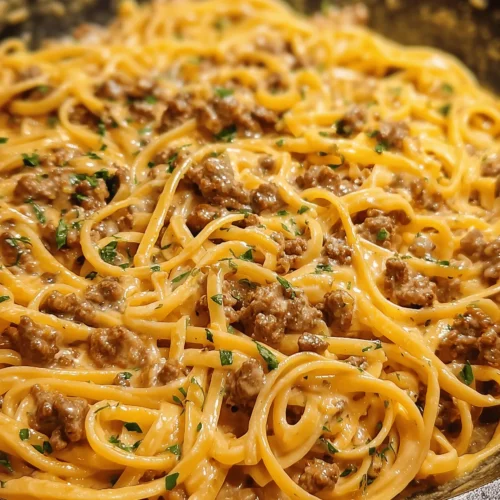 One Pot Creamy Beef and Garlic Butter Pasta served in a bowl with herbs on top