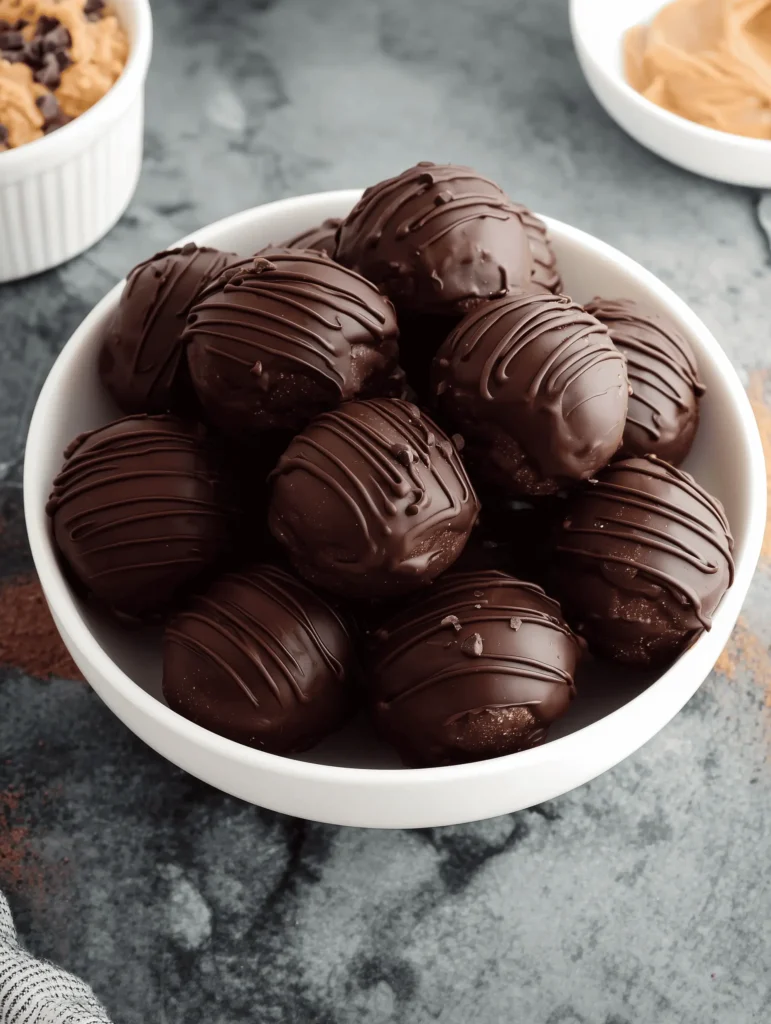 Chocolate Peanut Butter Balls are creamy, rich, and coated in smooth chocolate for the perfect easy no-bake dessert treat.