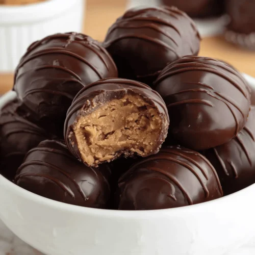 Chocolate Peanut Butter Balls are creamy, rich, and coated in smooth chocolate for the perfect easy no-bake dessert treat.