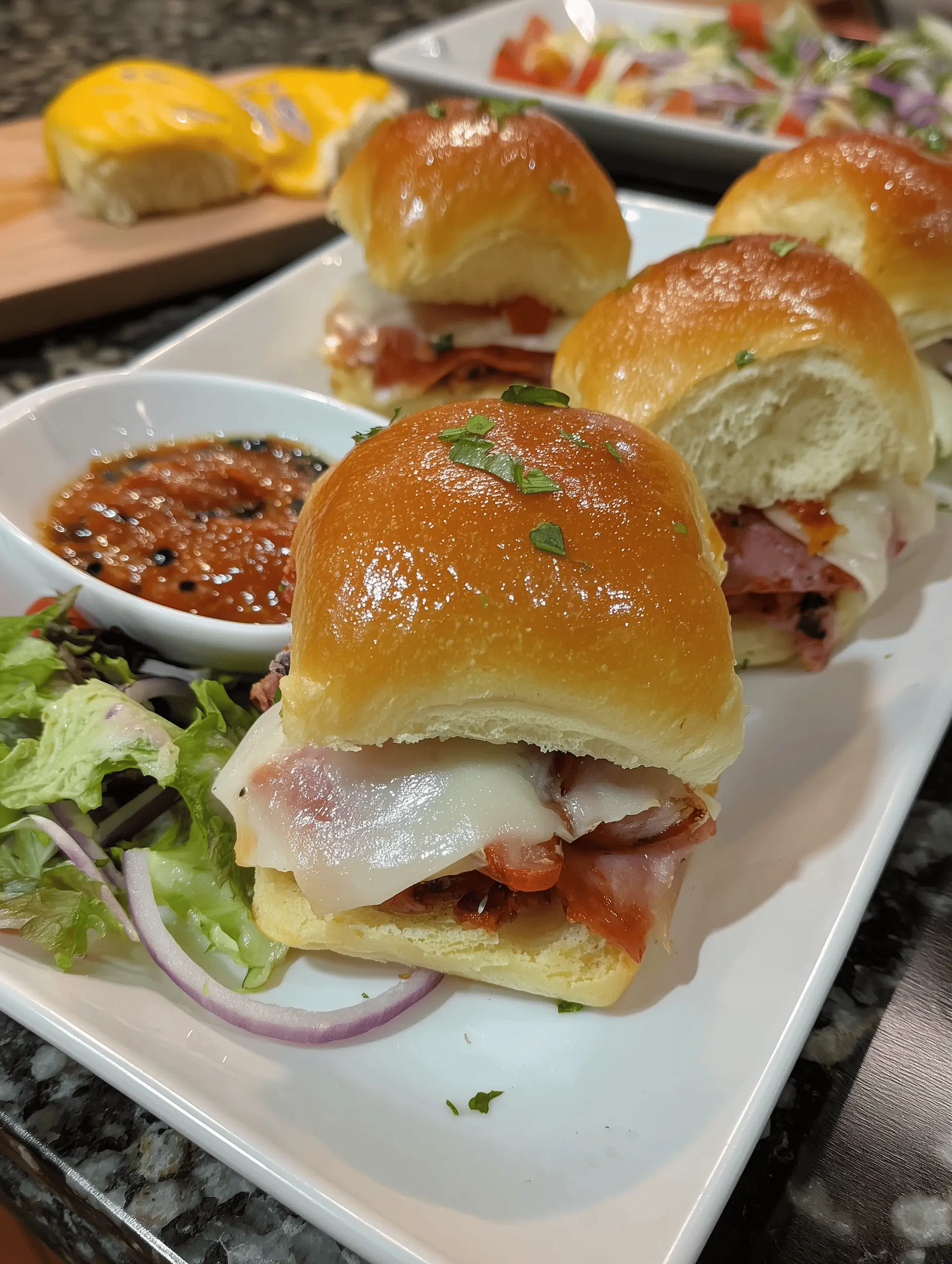 Delicious and Easy Italian Sliders on Hawaiian Rolls, provolone, and peppers on soft buns