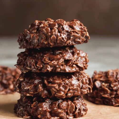 Delicious No-Bake Chocolate Oatmeal Cookies topped with chocolate and oats.